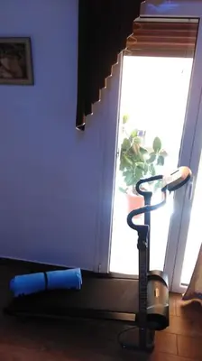 a vacuum in a room next to a window at Διαμέρισμα στην καρδιά της Αθήνα in Athens