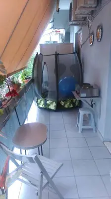 a balcony with a table and chairs in a room at Διαμέρισμα στην καρδιά της Αθήνα in Athens