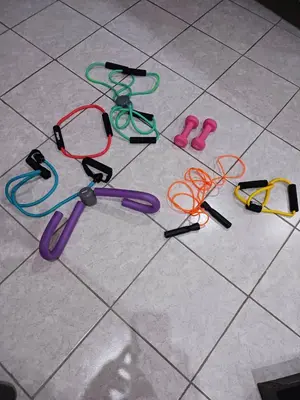 a group of different colored skipping ropes on a tile floor at Διαμέρισμα στην καρδιά της Αθήνα in Athens