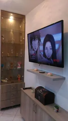 a flat screen tv on a wall in a living room at Διαμέρισμα στην καρδιά της Αθήνα in Athens