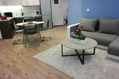 a living room with a couch and a table at Luxury apartment near Acropolis of Athens in Athens