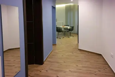 an open hallway with a table in the background and a room at Luxury apartment near Acropolis of Athens in Athens