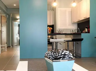 a kitchen with a island with a pile of rocks at Cozy apartment close to Acropolis in Athens