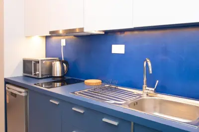 a kitchen with a sink and a counter top at Luxury studio in Greek island style in Athens