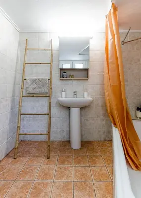 a bathroom with a sink and a ladder at Penthouse 2Bd apartment in the heart of Koukaki in Athens