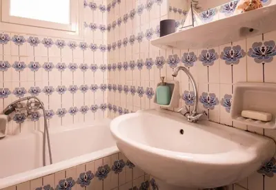 a bathroom with a sink and a bath tub and a sink at Beautiful house in Chalandri in Athens