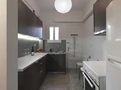 a kitchen with a sink and a counter top at Fyllis17 - Cozy apartment in the heart of Athens in Athens