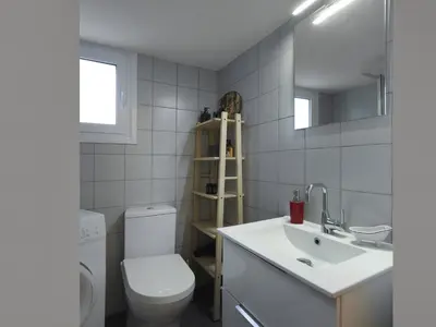 a white bathroom with a toilet and a sink at Fyllis17 - Cozy apartment in the heart of Athens in Athens