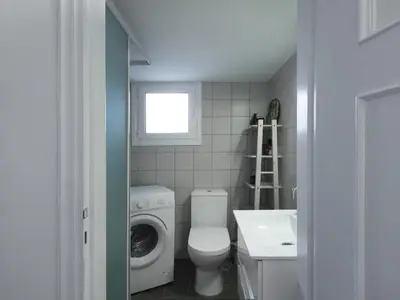 a bathroom with a washing machine and a sink at Fyllis17 - Cozy apartment in the heart of Athens in Athens