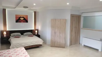 a bedroom with a bed and a window at Evelina's studio in Artemida