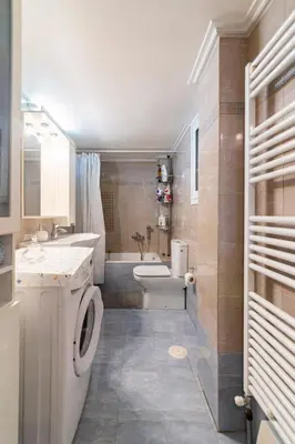 a bathroom with a toilet and a sink and a tub at Athens Walk in Athens