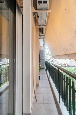 a corridor of a building with a balcony at Athens Walk in Athens
