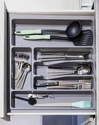 a drawer full of utensils in a refrigerator at Theo's Cozy Apartment's near Athens airport in Spáta