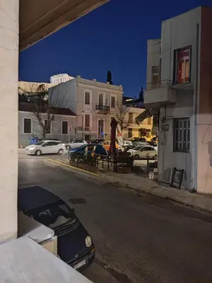a view of a street with cars parked on the street at Sunny apartment right under Parthenon in Athens