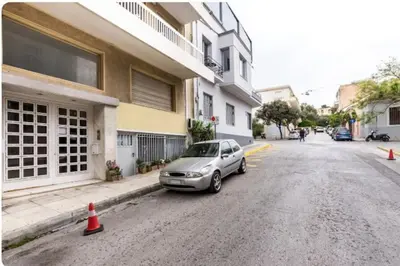 a silver car parked on the side of a street at Sunny apartment right under Parthenon in Athens