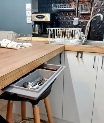 a drawer in a kitchen with utensils in it at Sunny apartment right under Parthenon in Athens