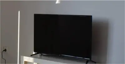 a flat screen tv sitting on top of a shelf at COMFY Flat, Athens city center in Athens