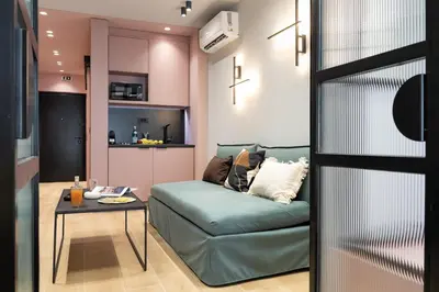 a living room with a couch and a table at Dion Luxury Suites in Athens