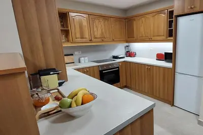 a kitchen with a bowl of fruit on a counter at ACROPOLIS GATE in Athens