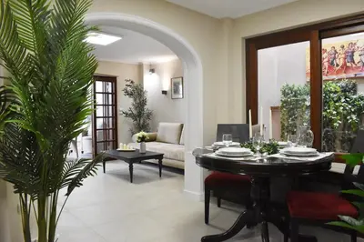 a living room with a table and a couch at ACROPOLIS GATE in Athens