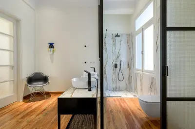 a bathroom with a shower and a sink and a toilet at Your 4 bdrm Dream House Acropolis View & Jacuzzi in Athens