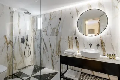a bathroom with a sink and a mirror at Your 4 bdrm Dream House Acropolis View & Jacuzzi in Athens