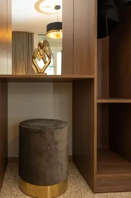 a room with a wooden shelf with a trash can at Dema Luxury Suites - Perikleous E6 in Athens