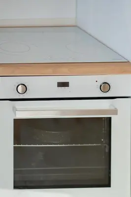a stove top oven with a white counter top at Be Home Sea View in Porto Rafti