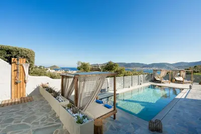 a villa with a pool and a view of the ocean at Be Home Sea View in Porto Rafti