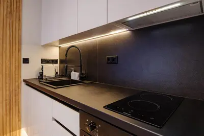 a kitchen with a sink and a counter top at Goudi 4th Floor Greece Apartments in Athens