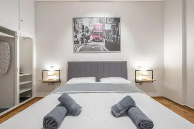 a bedroom with a bed with a double decker bus at Goudi 4th Floor Greece Apartments in Athens