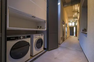 a laundry room with a washer and dryer in it at Athenian Island Project in Athens