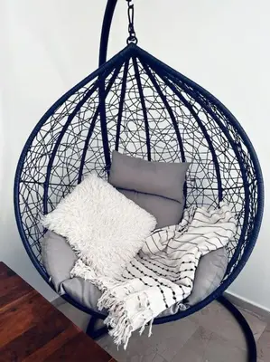 a hanging basket with pillows and a blanket at Minimal 3BR Apartment in Athens in Athens