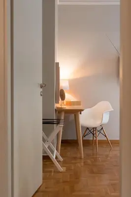 a table and two chairs in a room at Athens City Apartment the Nest of Filoxenia in Athens