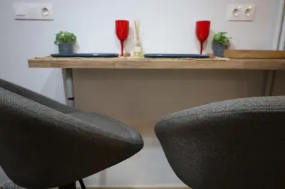 a desk with two chairs and a table with two laptops at Marina Zeas Seaside Studio-MarinaQ in Piraeus