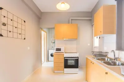 a kitchen with a sink and a stove top oven at A modern and spacious flat in Gazi in Athens