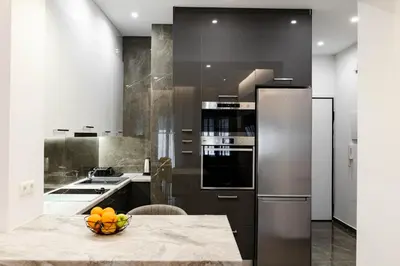 a kitchen with a counter with a bowl of fruit on it at Larissa Railway &Metro station apartment in Athens