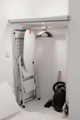a room with a chair under a table at Cosy studio in the Petralona neighbourhood in Athens