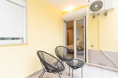 a room with two chairs and a mirror at elegant escapes 2 nea smyrni in Athens