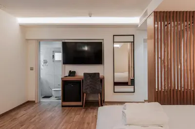 a living room with a couch and a desk at Urban Frame Acropolis in Athens