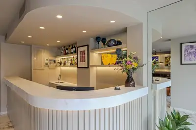 a lobby with a counter with flowers on it at Urban Frame Acropolis in Athens