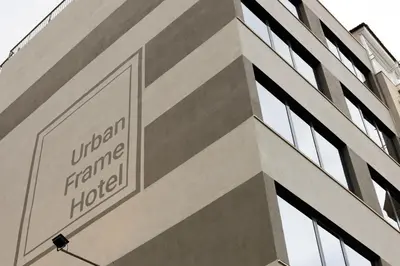 a building with a sign on the side of it at Urban Frame Acropolis in Athens