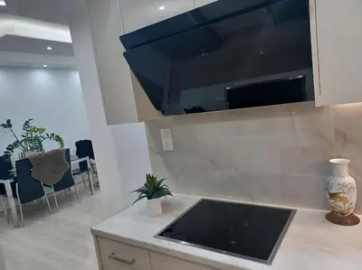 a kitchen with a sink and a counter top at Cozy Renovated Apartment in Athens