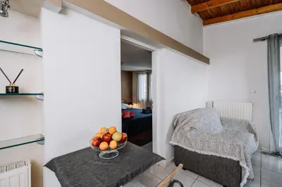 a room with a table with a bowl of fruit on it at Penthouse of diamond in Athens