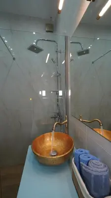a bathroom with a wooden sink and a mirror at City Life Metro Ambelokipi in Athens