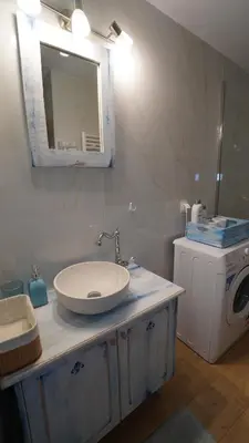 a bathroom with a sink and a washing machine at City Break Metro Ambelokipi in Athens