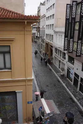 a city street with people walking down a street at Historic Center Luxury Studio Apartment in Athens