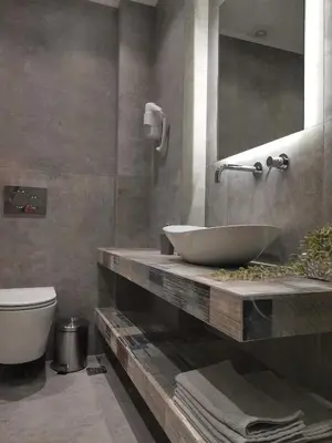 a bathroom with a sink and a toilet at Historic Center Luxury Studio Apartment in Athens
