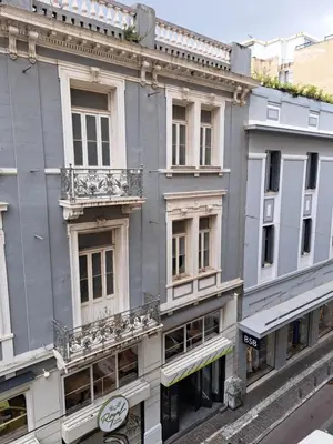 a building with balconies on the side of it at Historic Center Luxury Studio Apartment in Athens
