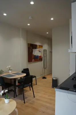 a kitchen and dining room with a table and chairs at Historic Center Luxury Studio Apartment in Athens